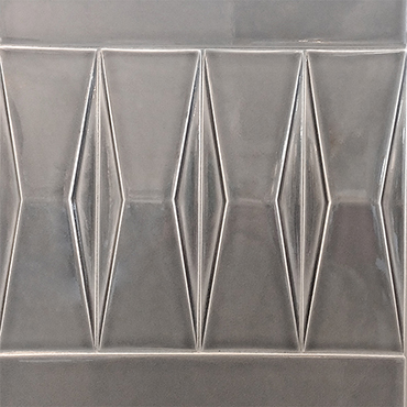 Bas relief tile in gray