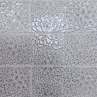 Bas relief tile in gray flower pattern